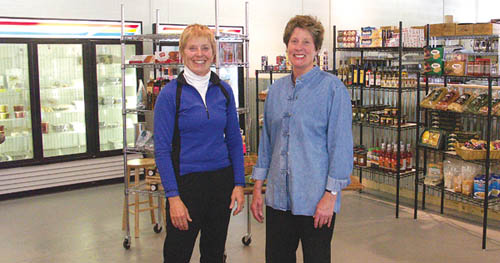 Sandra Vanderstoep (left) and Holly Mervis, co-owners of 
Garden of the Gods Gourmet Market & Catering at 2528 W. 
Cucharras St., pose inside the market area.