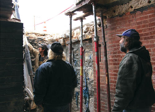 Standing in the basement of Fire Station 5, with the Colorado Avenue sidewalk above them, workers with CMS 
Construction consider the next step of the project to replace an engine bays failing concrete slab.
Westside Pioneer photo