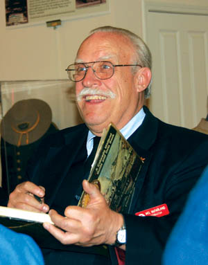 Local historian Mel McFarland signs a copy of one of his two books on the Midland Railway after his talk at the Old 
Colorado City History Center Feb. 16
Westside Pioneer photo