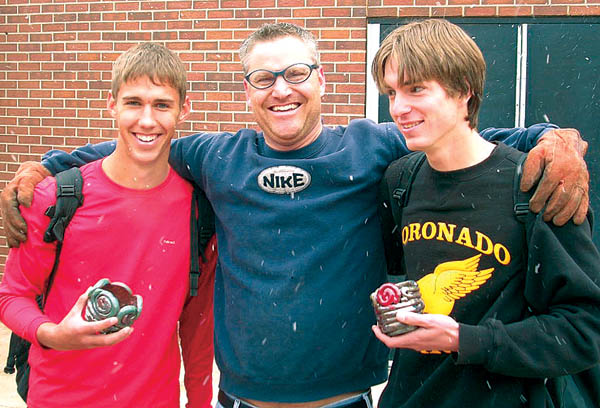 Amid snowfall, chemistry teacher Darin Smith with his chemists (potters for a day) John Slane, left, and Andrew Lesser.  
Courtesy of Sue March