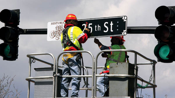 With approval from the boards of the Old Colorado City
merchants and the maintenance district, Colorado Springs
Traffic Engineering crews were installing historically geared signs at the intersections on Colorado Avenue April 16.
Westside Pioneer photo