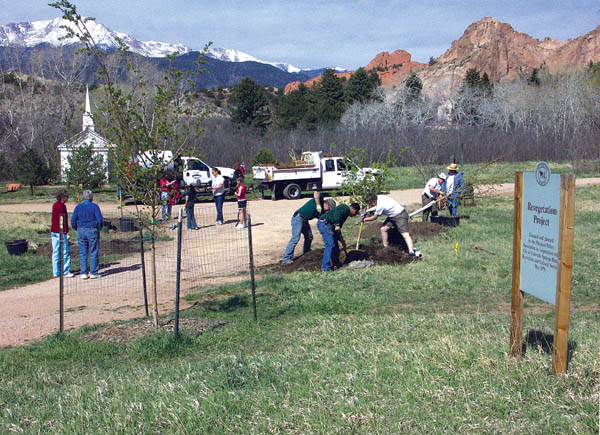 On the occasion of Earth Day April 21, Colorado Springs
Parks workers join volunteers in planting four more Toba
Hawthorne trees near the south access to Rock Ledge
Ranch April 21. The planting was organized by the ranchs
Living History Association, with donations covering most of
the $800 costs.The sign at right explains the continuing effort.
Westside Pioneer photos 