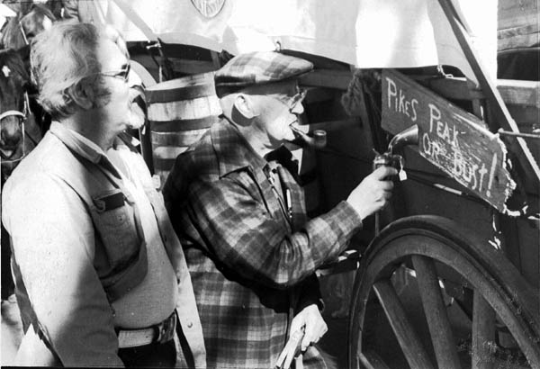 Gene Brent (left) watches Scotty Price use a gun butt to
hammer in a sign during the 1976 Territory Days. Brent
credits Price with suggesting the Old Colorado City territorial angle in 1975. 
Courtesy of Gene Brent