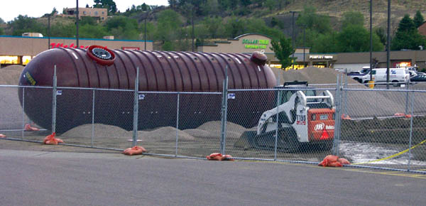 A future underground gas container waits to be installed at
the King Soopers fuel station in the Uintah Gardens
shopping center parking lot this week. The access will be
from the main entrance off Uintah Street. The station will be the second offered at a King Soopers store on the Westside.
Westside Pioneer photo