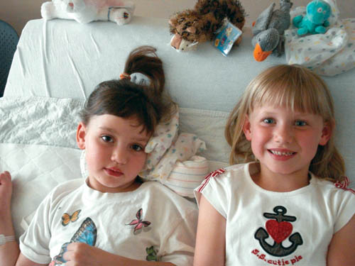 Lily Griesan (left) and her twin sister Valerie are shown during Lilys recent stay at Childrens Hospital in Aurora.
Courtesy of the Griesan family