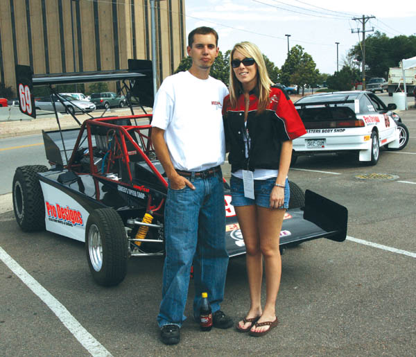 Jimmy and Melissa Keeney with his open wheeler (left) and her 2WD car during the Hill Climb technical inspection at the 
Sheraton Hotel this week.
Westside Pioneer photo