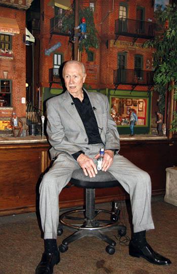 With some of his scenes and characters as a backdrop, Michael Garman answers questions from local media during 
a press conference inside his gallery in Old Colorado City Aug. 11.
Westside Pioneer photo