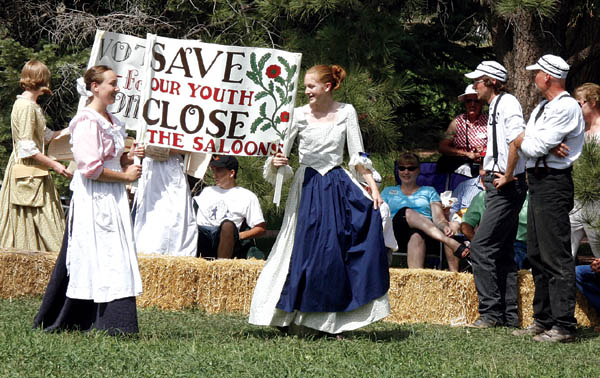 Ballists look on with manly scorn while Rock Ledge's docent suffragettes, wanting to give women the right to vote, disrupt 
something far more important - the baseball game.
Westside Pioneer photo