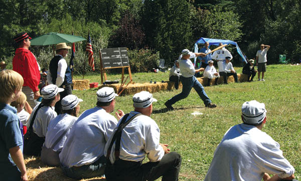 Scenes from the vintage baseball game played at Rock Ledge Ranch Historic Site Labor Day, Sept. 3 ... 
Camp Creek Cloud Buster striker Trevor Bruiser Fisk takes a mighty cut while his teammates look on from their haybale dugout.
Westside Pioneer photo