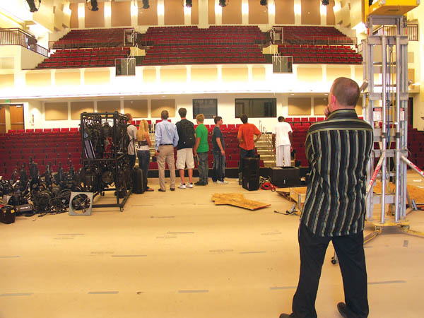 Coronado High Choir Director Jeff Hodur (right, foreground) contemplates the new auditoriums interior while at the 
same time Assistant Principal David Engstrom (light blue shirt) gives a quick tour to a group of students Sept. 17. 
Westside Pioneer photo