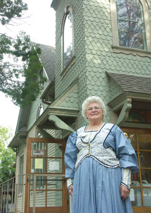 Before leading a tour last summer, Jean Christopher posed 
in front of the History Center. 
Westside Pioneer photo