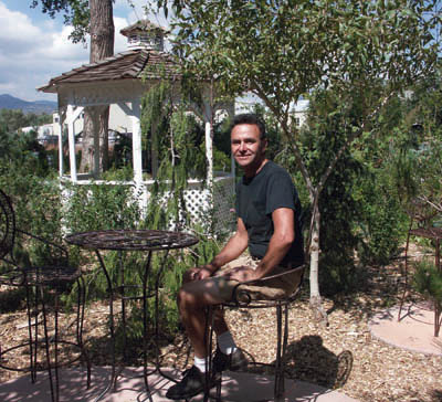 On a pleasant afternoon in late summer, Steve Muzzipapa 
enjoys the sunshine near a gazebo in the event site 
portion of his Secret Garden: Nursery and Event Site at 420
S. 19th St. The business is open as a nursery from April 
through September, but for events (particularly weddings) year-round.
 Westside Pioneer photo
