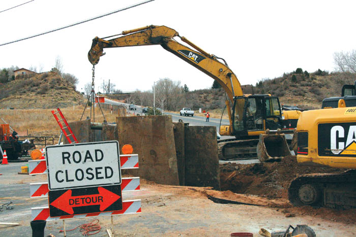 Large machinery blocks 19th Street and part of King Street
(by Oswego Street) in a photo looking east Dec. 9. Colorado Springs Utilities hopes to have the
wastewater-upgrade project finished this week.  
Westside Pioneer photo