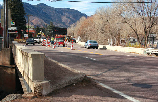 Looking west, the 1934-built Colorado Avenue bridge over
Fountain Creek is shown last week when Utilities work was blocking two of the lanes. Behind the trees at right is the Garden of the Gods Campground.
Westside Pioneer photo