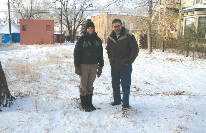 Elise Miller and Larry Stebbins of Pikes Peak Urban Gardens pose in the now-snowy vacant lot at 2825 W. Pikes Peak 
Ave. that they are helping turn into a community garden. 
Westside Pioneer photo