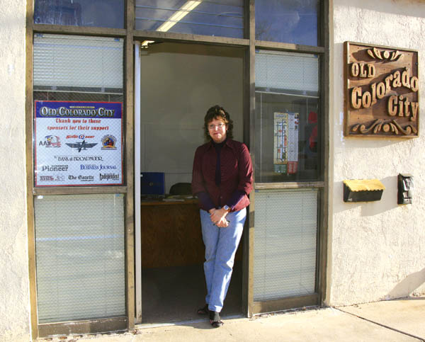 Recently hired Old Colorado City Associates marketing
director Karen Earley takes in the late-afternoon sun in the
doorway of the office that has been prepared for her in the city-owned maintenance building.
Westside Pioneer photo